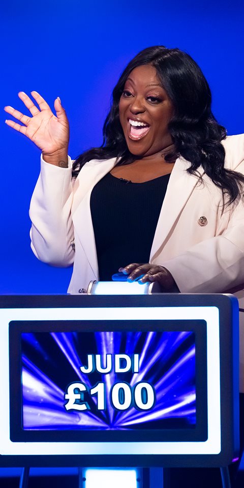 Woman participating in a game show.